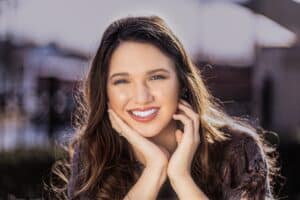 Woman smiling brightly after professional teeth whitening treatment in Melissa, TX.