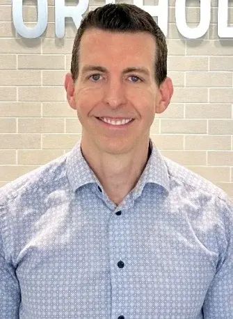 Dr. Steven Blackburn, dentist at Melissa, TX dental practice, smiling for portrait.
